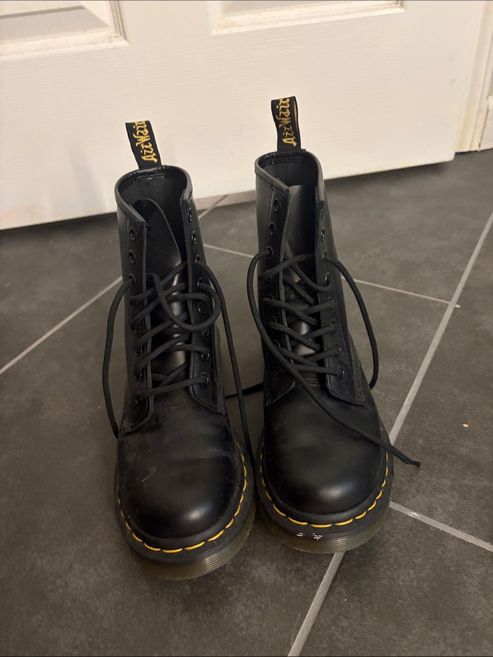 Dr. Martens Black Leather 8-Eye Lace-Up Boots with Yellow Welt Stitching